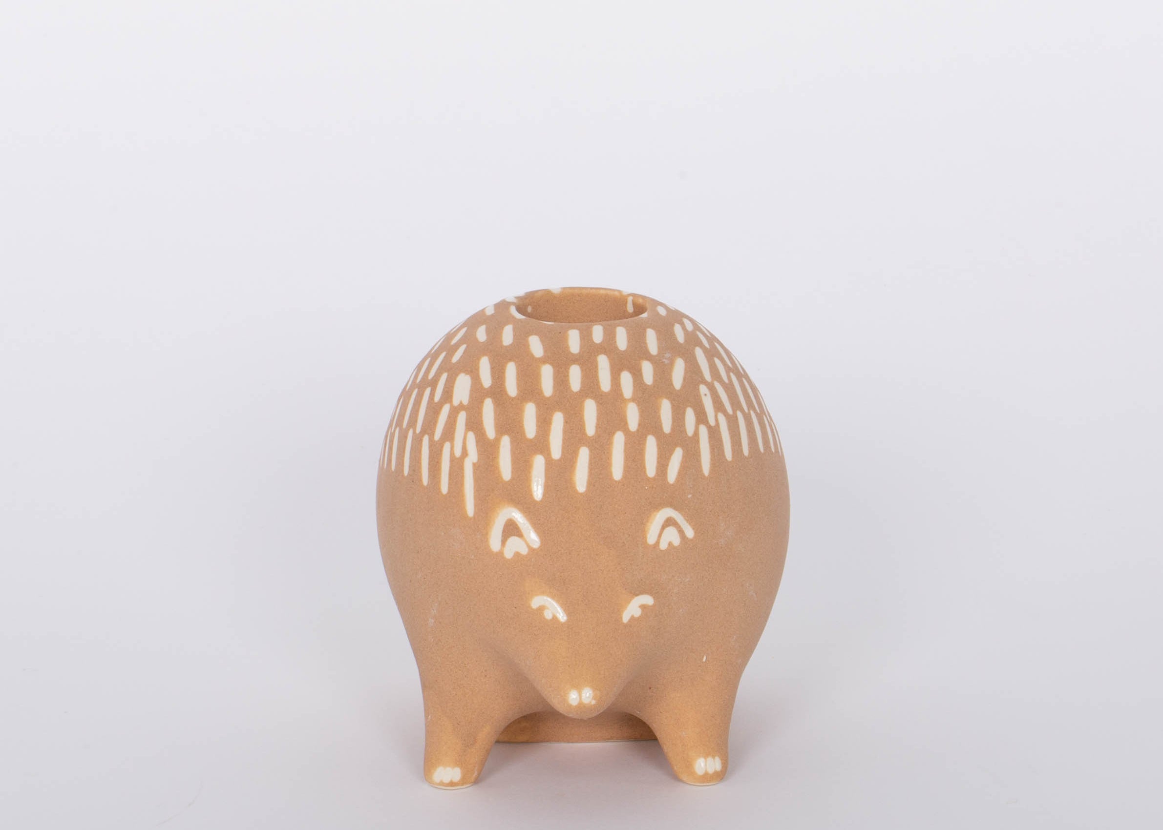 Hedgehog Bramley Candle Holder. Intricate design features carefully crafted metal branches that cradle the candle for a unique and romantic look. Incredibly versatile, this piece can be used to create an intimate ambiance or simply as a beautiful home accent. 