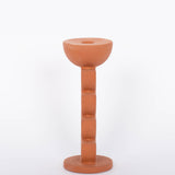 Cadwell Candle Holder stacked half moon design in natural terracotta for taper candles. Side view. White background. 